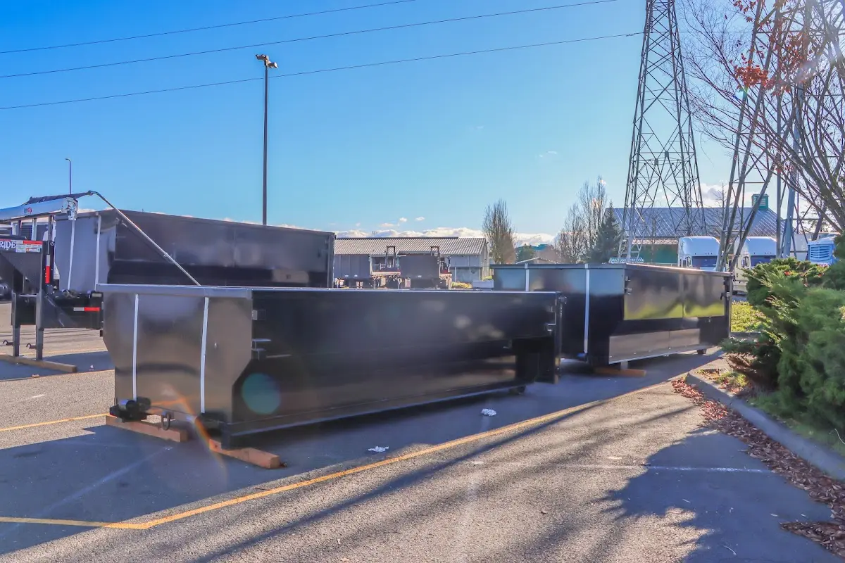 Roll-off dumpster ready for waste disposal at job site for Concrete Dumpster Rental in Edgewood
